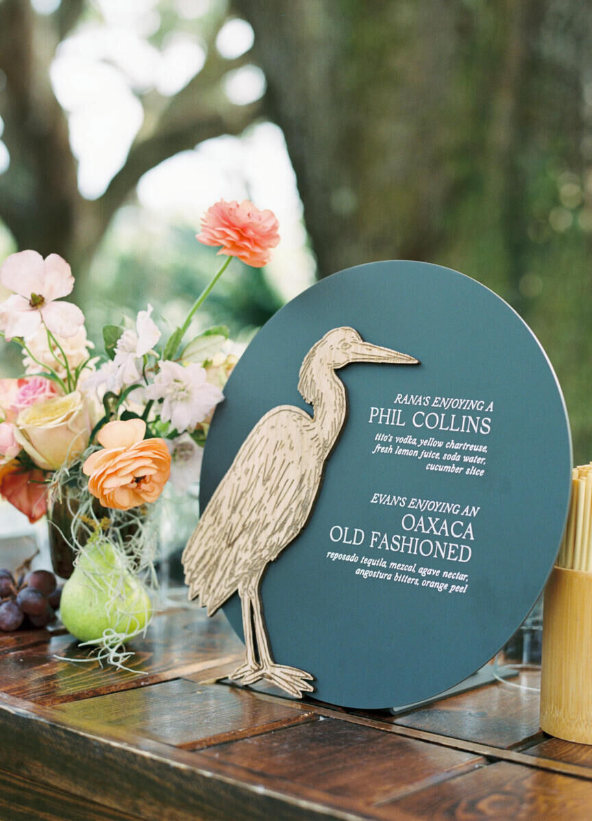 One-of-a-kind bar signage outlined the signature drinks for an elegant spring wedding, and featured a heron, which was one of the motifs used throughout the stationery.