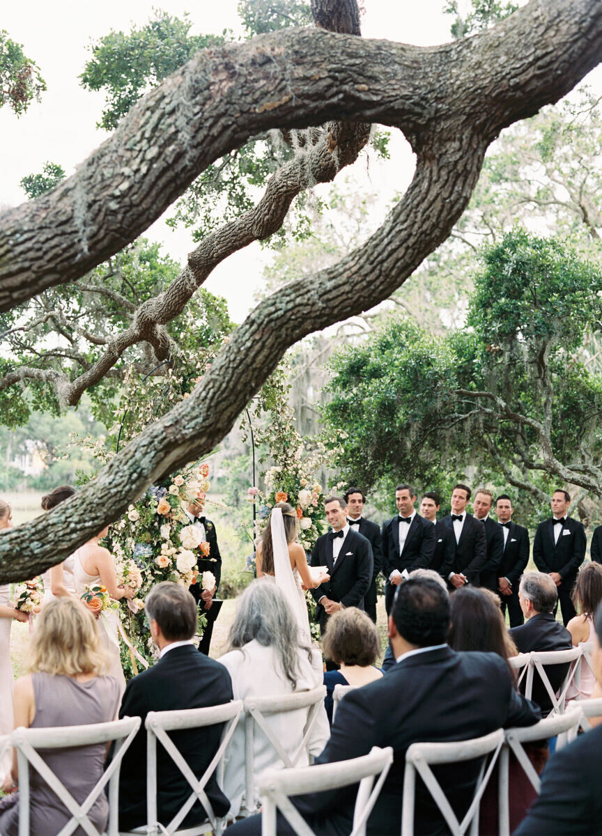 An elegant spring wedding ceremony took place among the South Carolina oak trees.