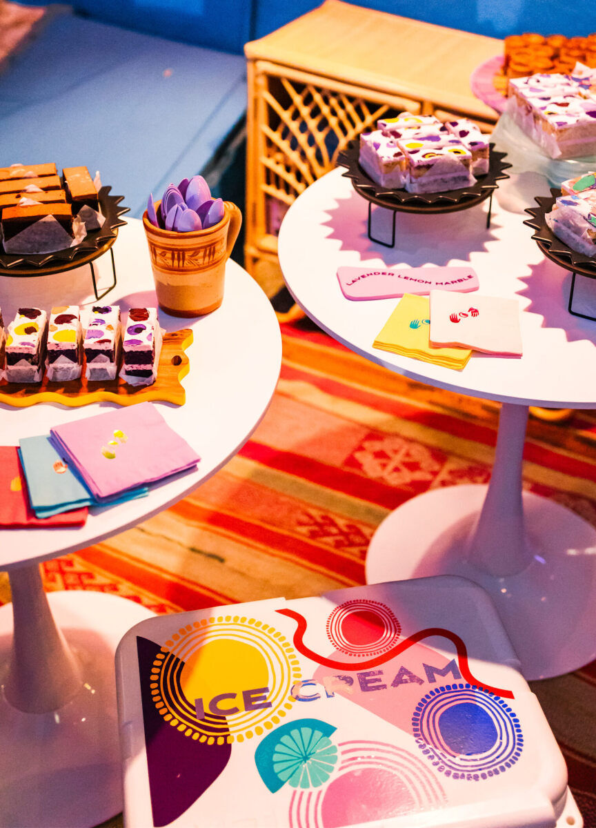 In addition to cake, a cooler was stocked with ice cream during a vibrant, outdoor wedding reception in California.
