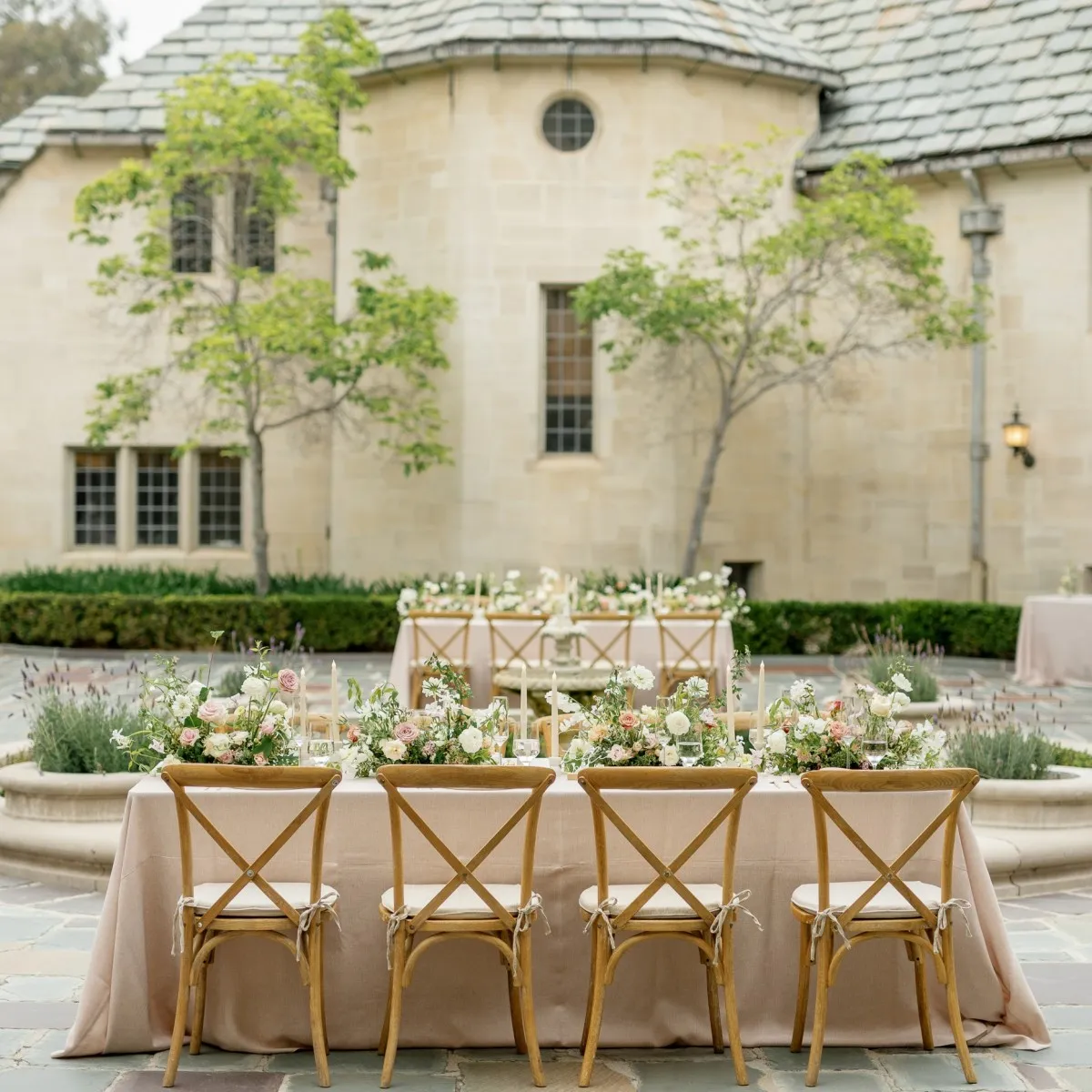 wedding etiquette shown via wedding table setup with floral arrangements